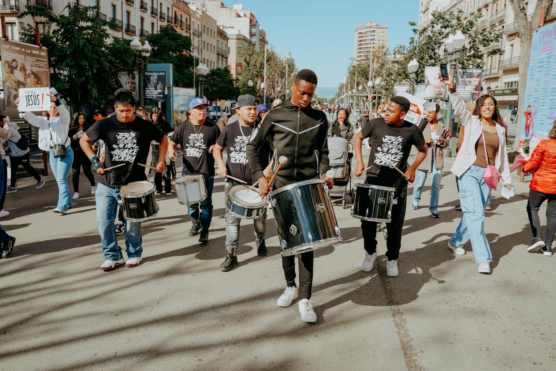 men with drums on a street