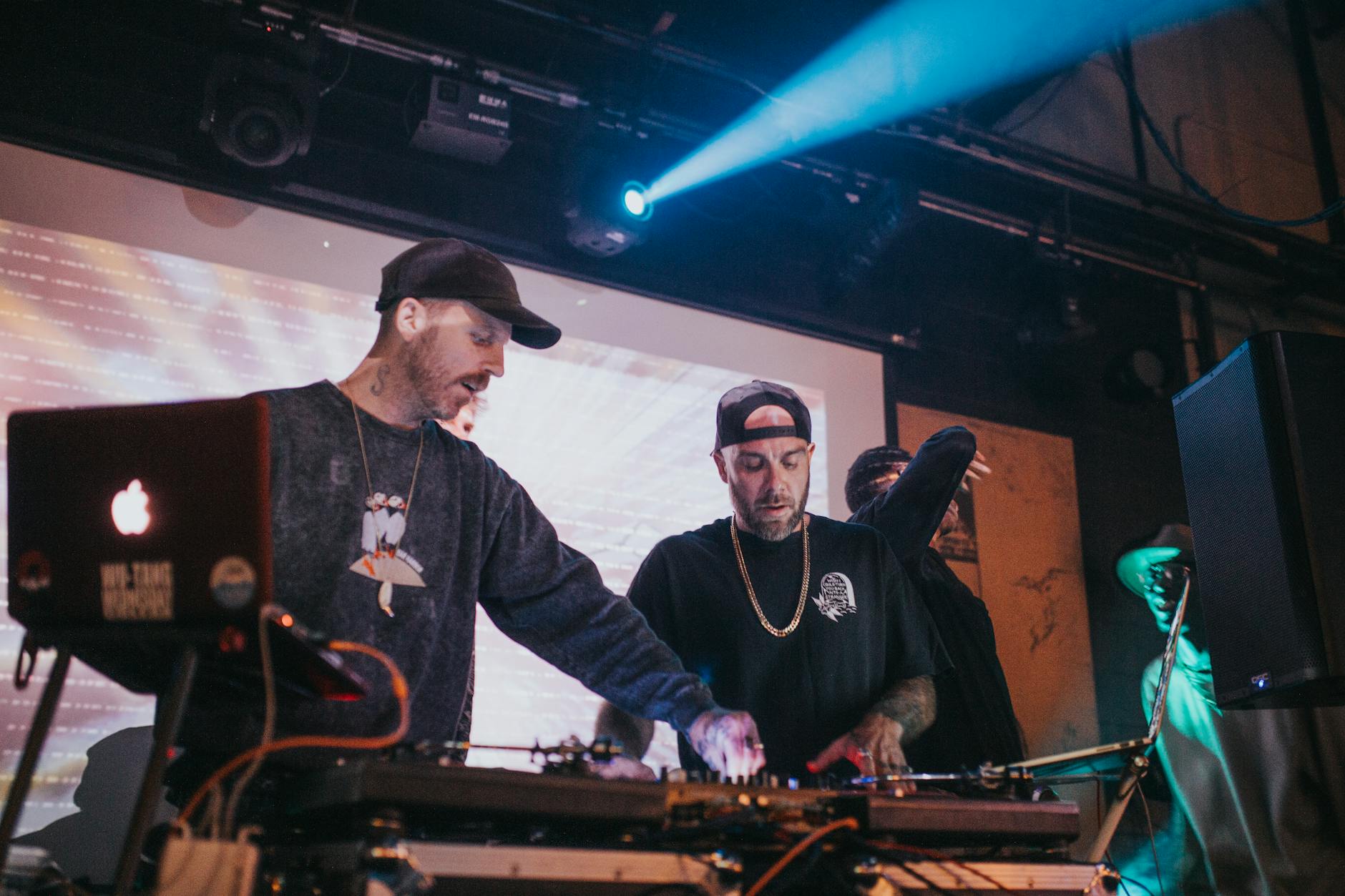 photo of men with caps performing a live show