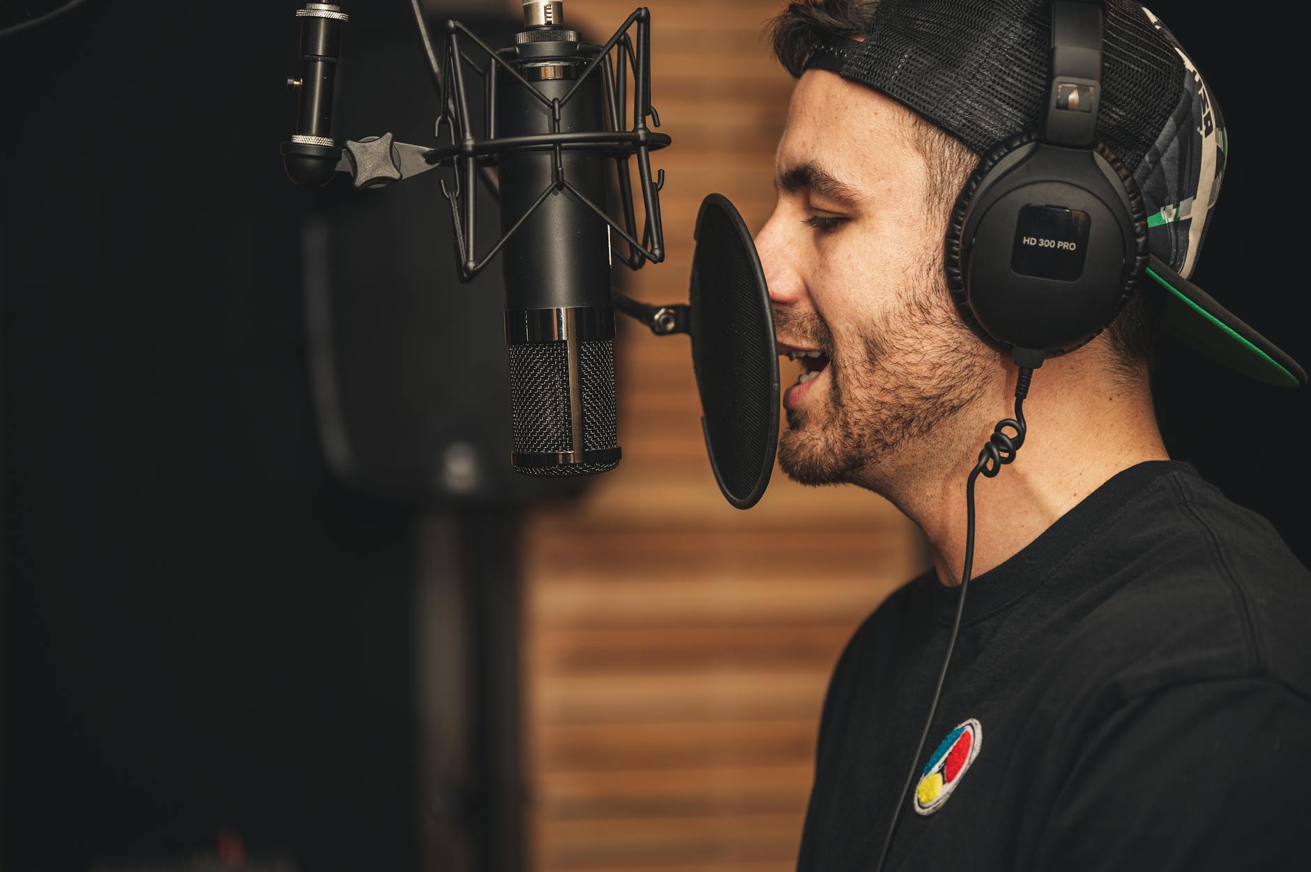 man in black crew neck t shirt wearing black headphones